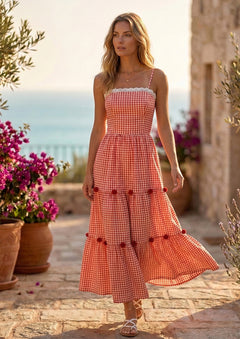 Woman wearing stylish and trending red checkered sleeveless dress 