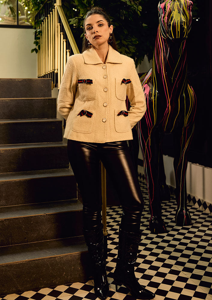 Off White Woolen Blazer With Bow Detailing