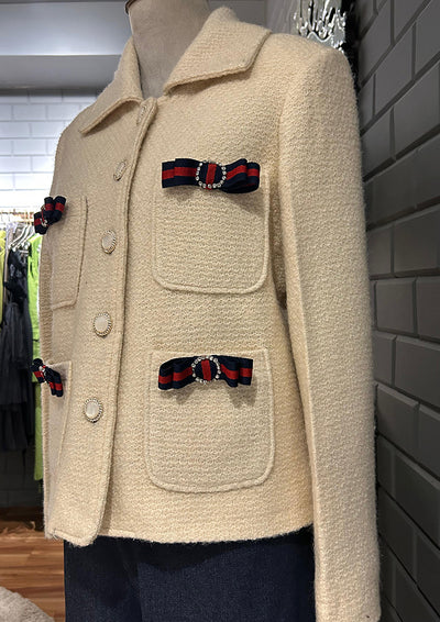 Off white woolen blazer with bow detailing