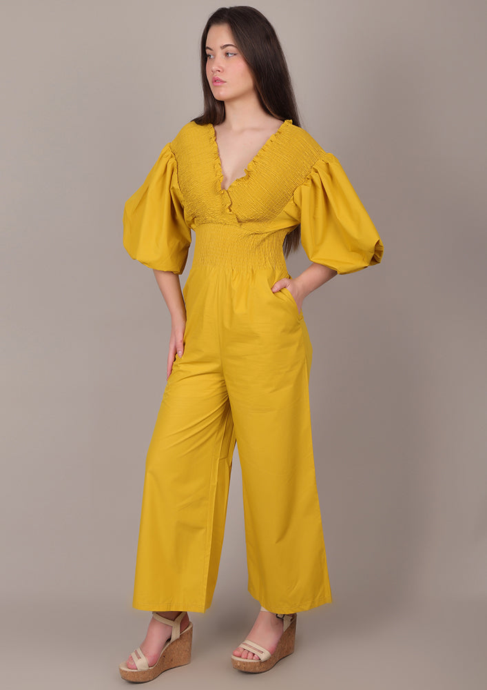 Yellow Smocked V-Neck Jumpsuit IKI CHIC Private Ltd.