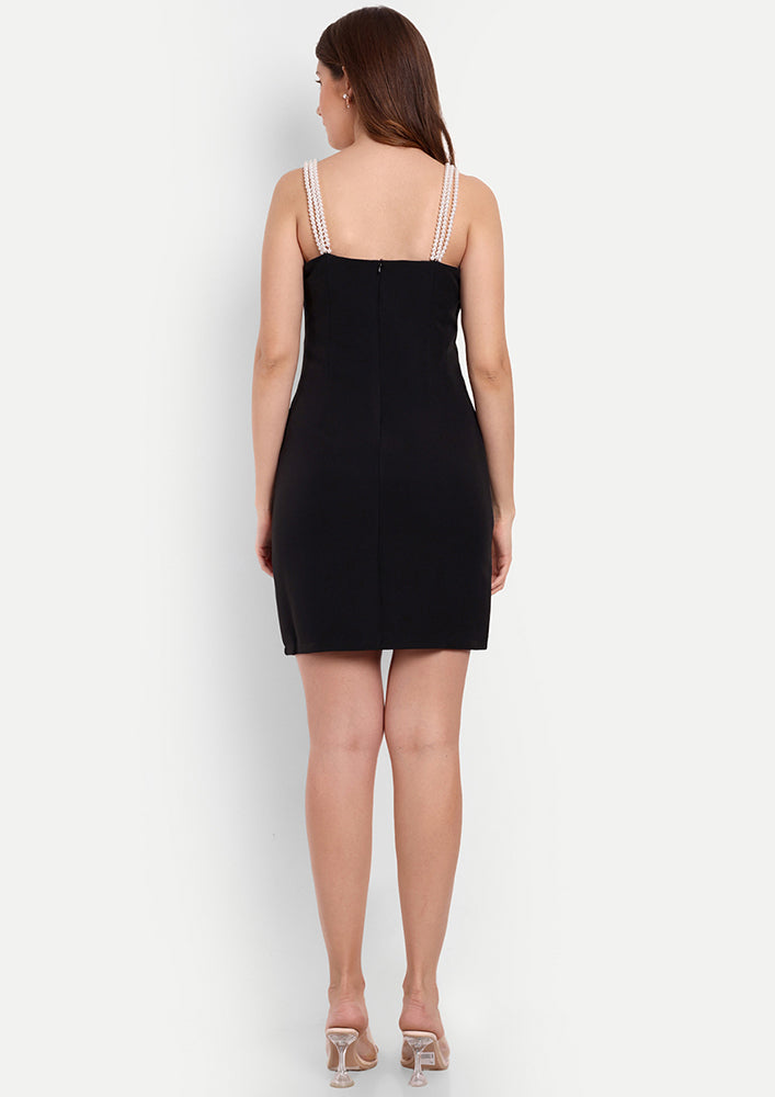 Black Bodycon Mini Dress With A Sweetheart Neckline And Pearl Straps