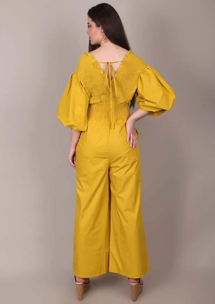 Yellow Smocked V-Neck Jumpsuit IKI CHIC Private Ltd.