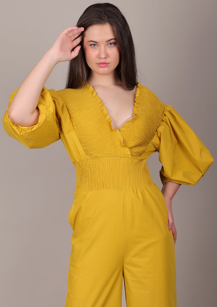Yellow Smocked V-Neck Jumpsuit IKI CHIC Private Ltd.