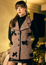 Women wearing stylish and trending Red & Black Tweed Lapel Collar Vest With Bows Applique On Front