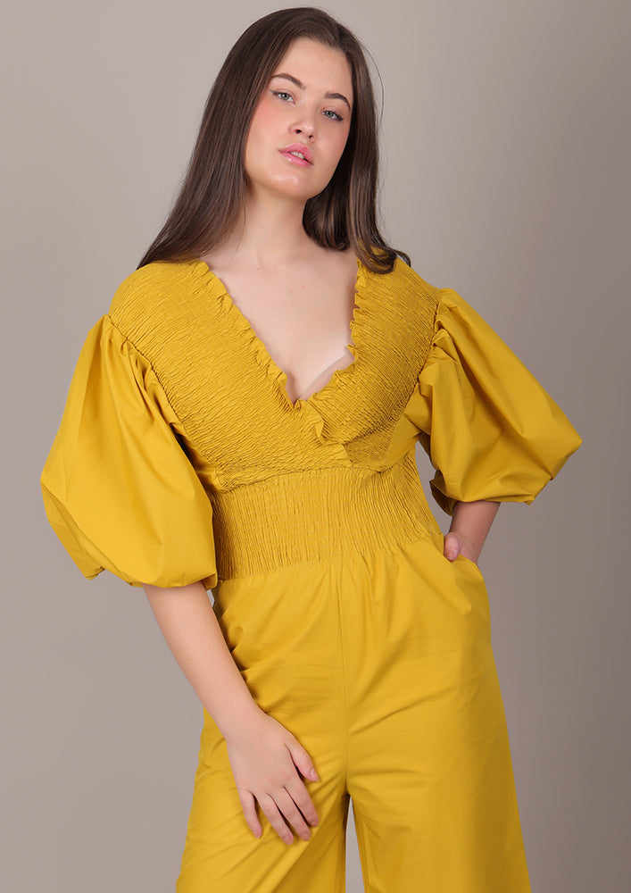 Yellow Smocked V-Neck Jumpsuit IKI CHIC Private Ltd.