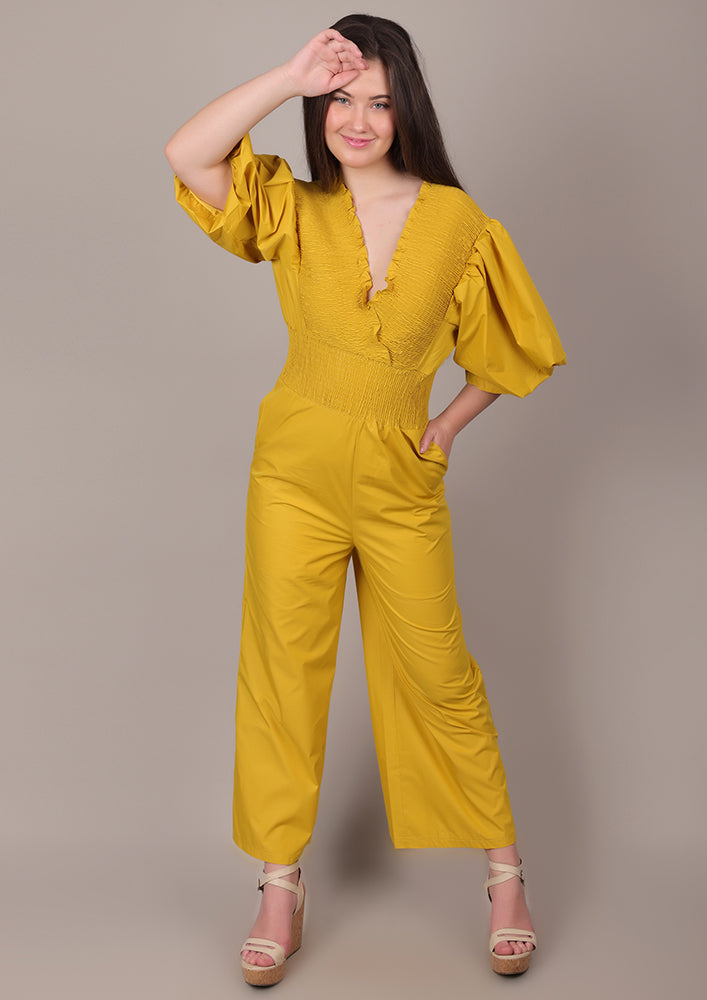 Yellow Smocked V-Neck Jumpsuit IKI CHIC Private Ltd.