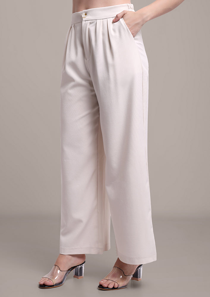 Off-White edgy tube top with wide leg pants set IKI CHIC Private Ltd.