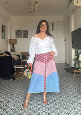 Woman wearing stylish trending White Peplum Top and Multi Stripe A-Line Skirt 